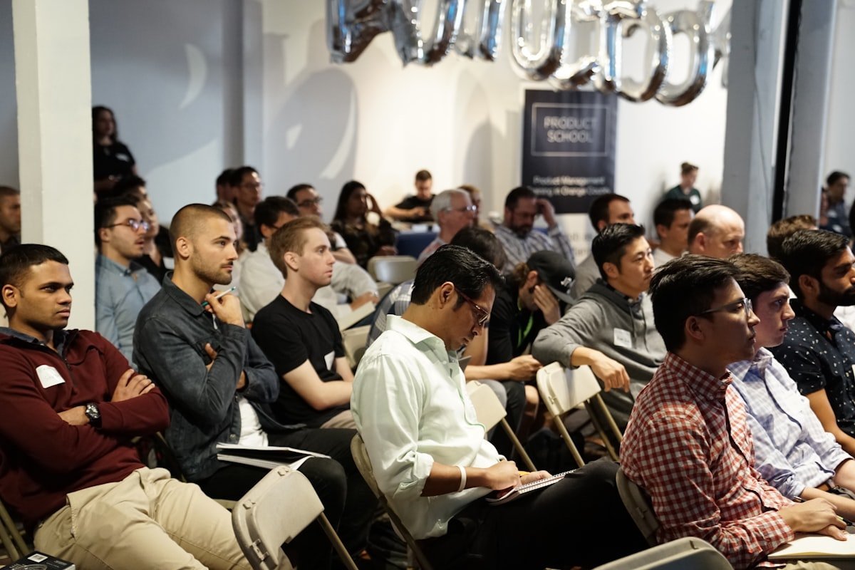 An audience leaning in to a speaker's story